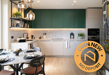 Kitchen / Dining area with moss green and off-white cupboards, modern decorations. An overlay stamp reads 'Own New - No Deposit'.