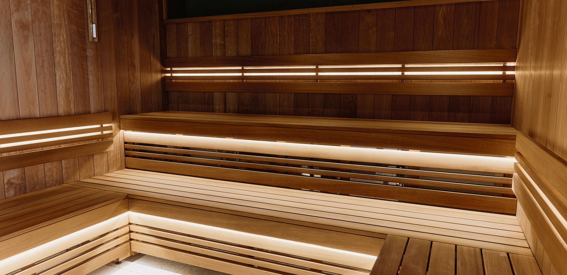 Dry spa-steam room with strip lighting.