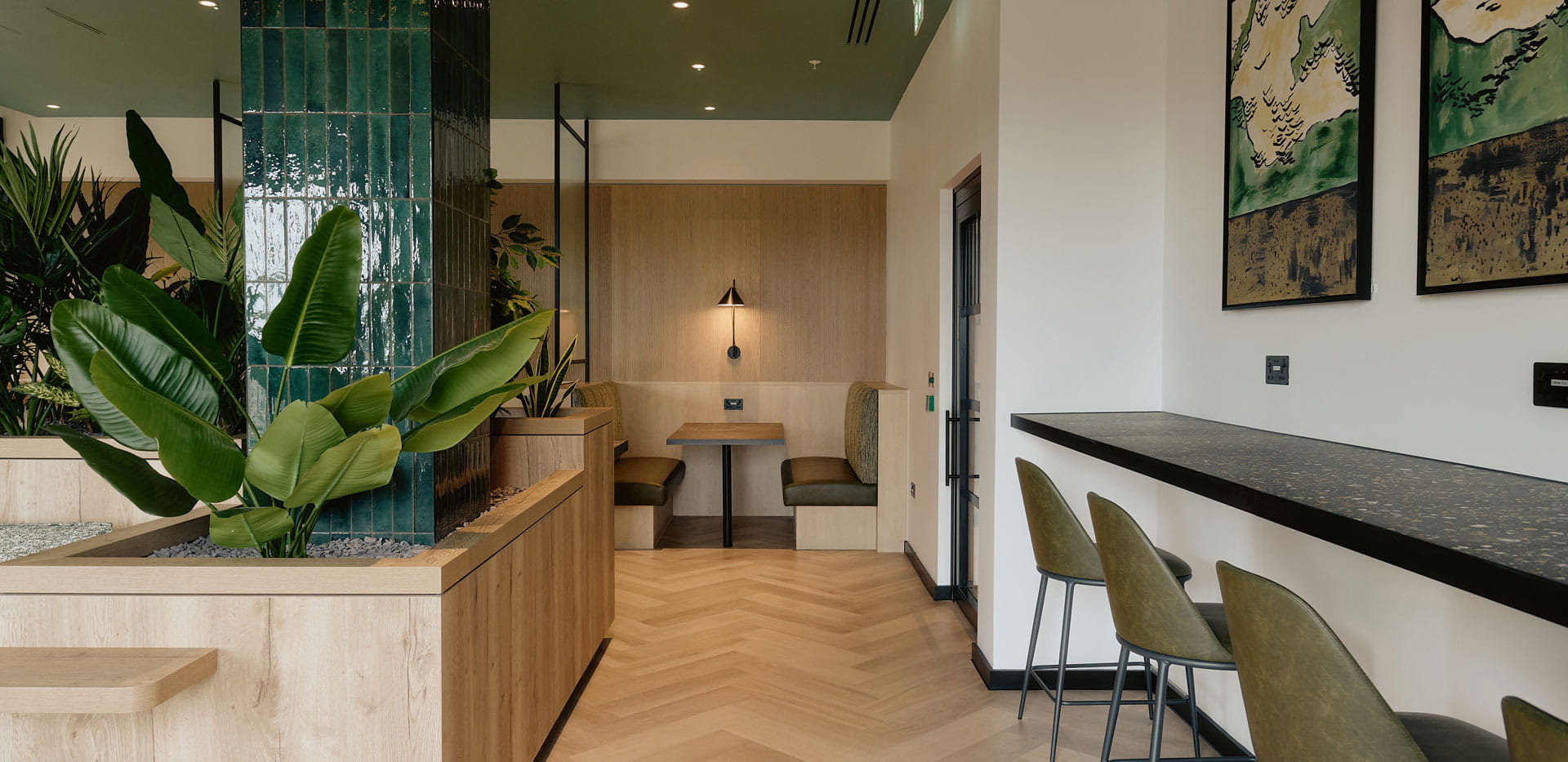Lounge bar and study area with wall chargers, long row seating.