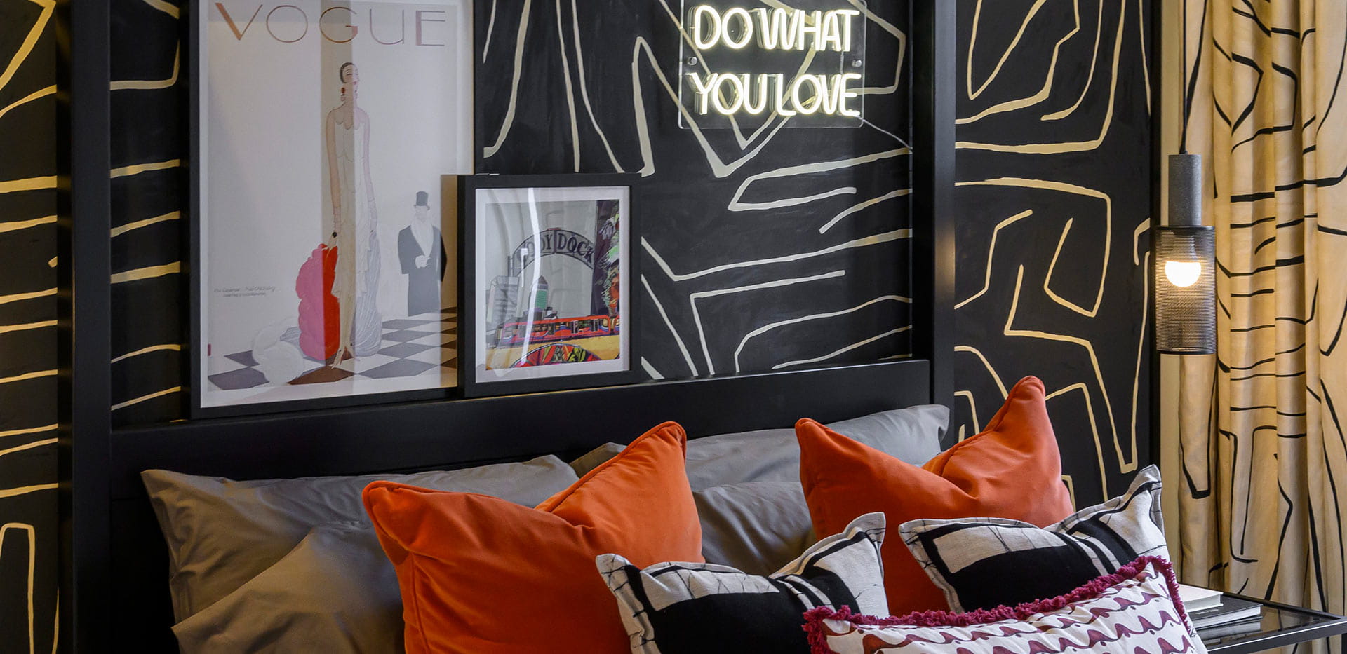 An image of a Bedroom with a black feature wall at Heron Wharf