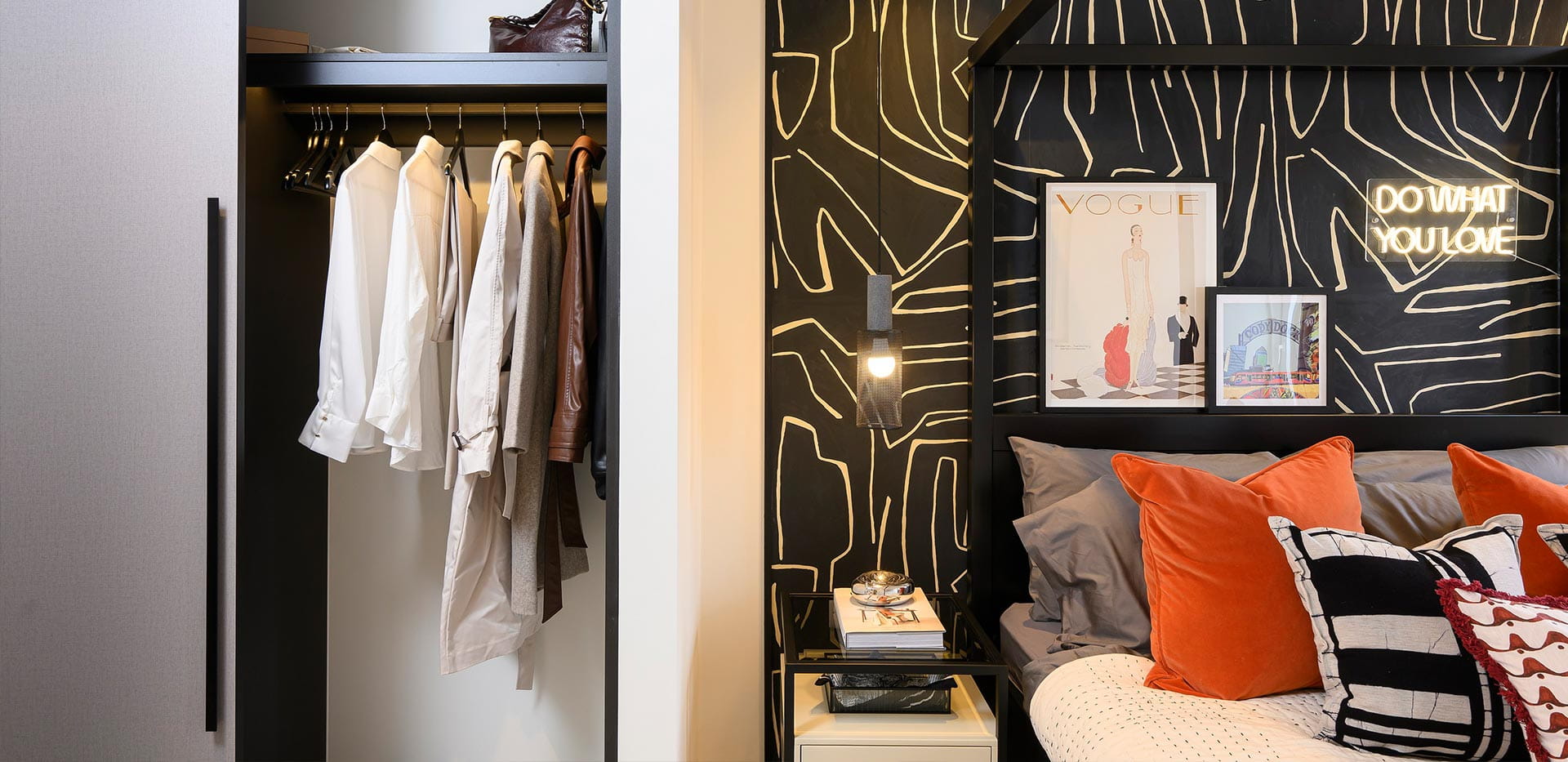 An image of a Bedroom with a black feature wall and Wardrobe at Heron Wharf