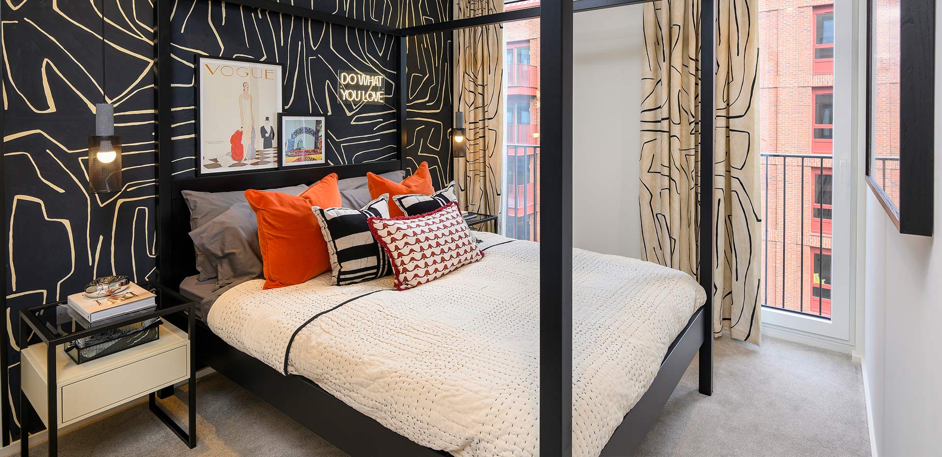 An image of a Bedroom with a black feature wall and bed frame at Heron Wharf