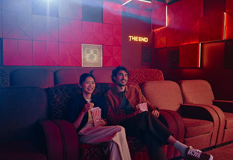 An image of people at the Cinema Room at The Riverside Club