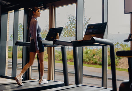 An image of a woman on the running machine at The Riverside Club