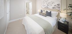 Highwood Village bedroom with a clean white design
