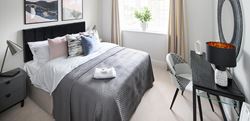 Dareham Court double bedroom with office space and minimal, clean design