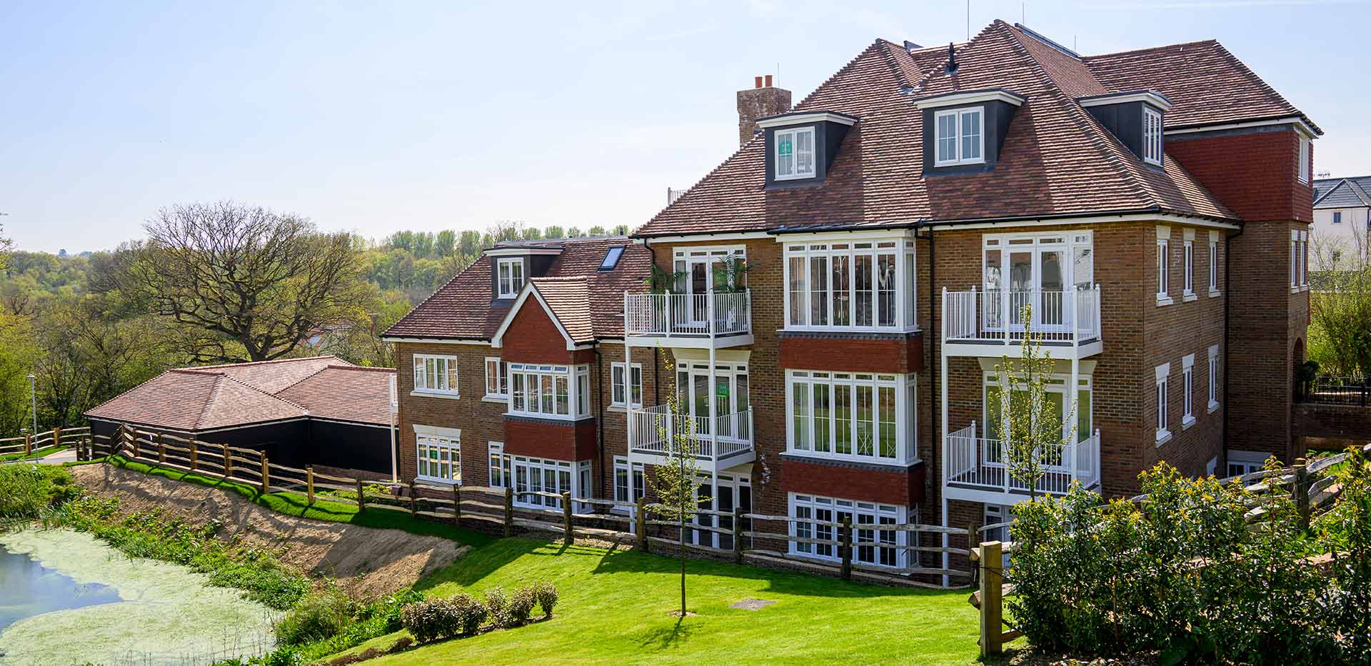 Hollyfields apartments exterior photos featuring gardens