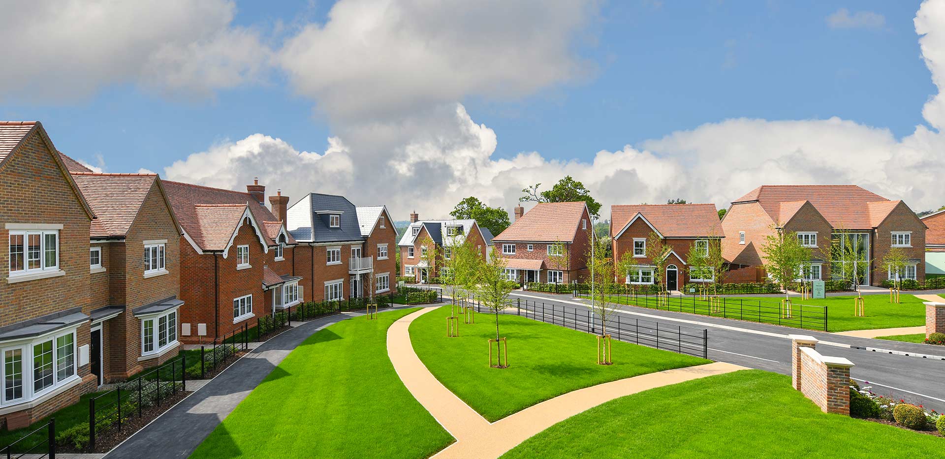 Hollyfields exterior photo of homes surrounding a park