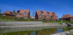 Hollyfields exterior photo of homes overlooking canal