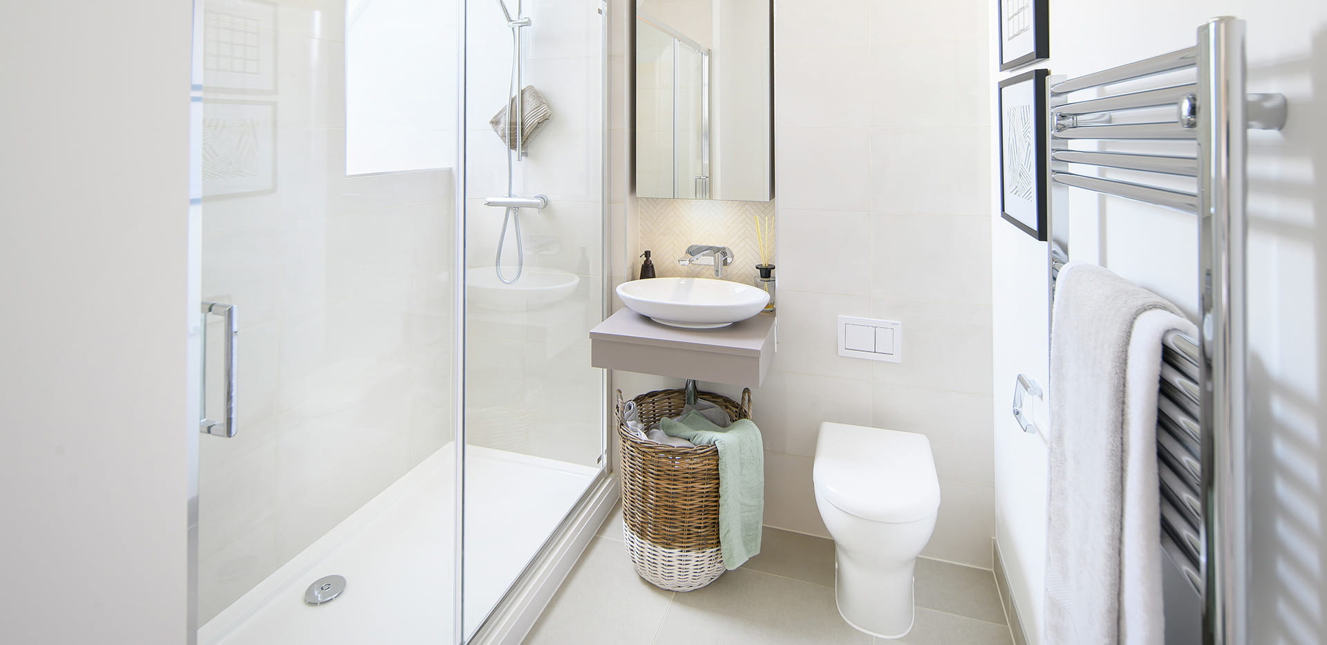 Hollyfields two bedroom apartment shower room with a light theme