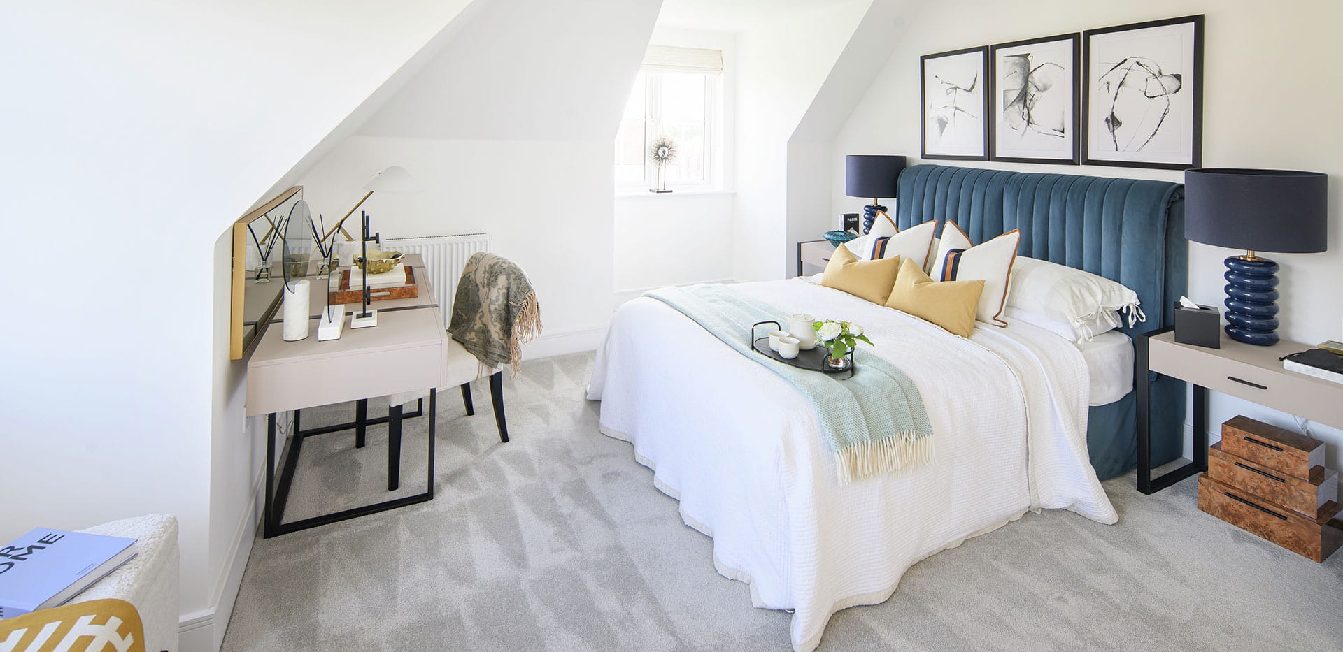 Hollyfields two bedroom apartment large bedroom with a neutral design