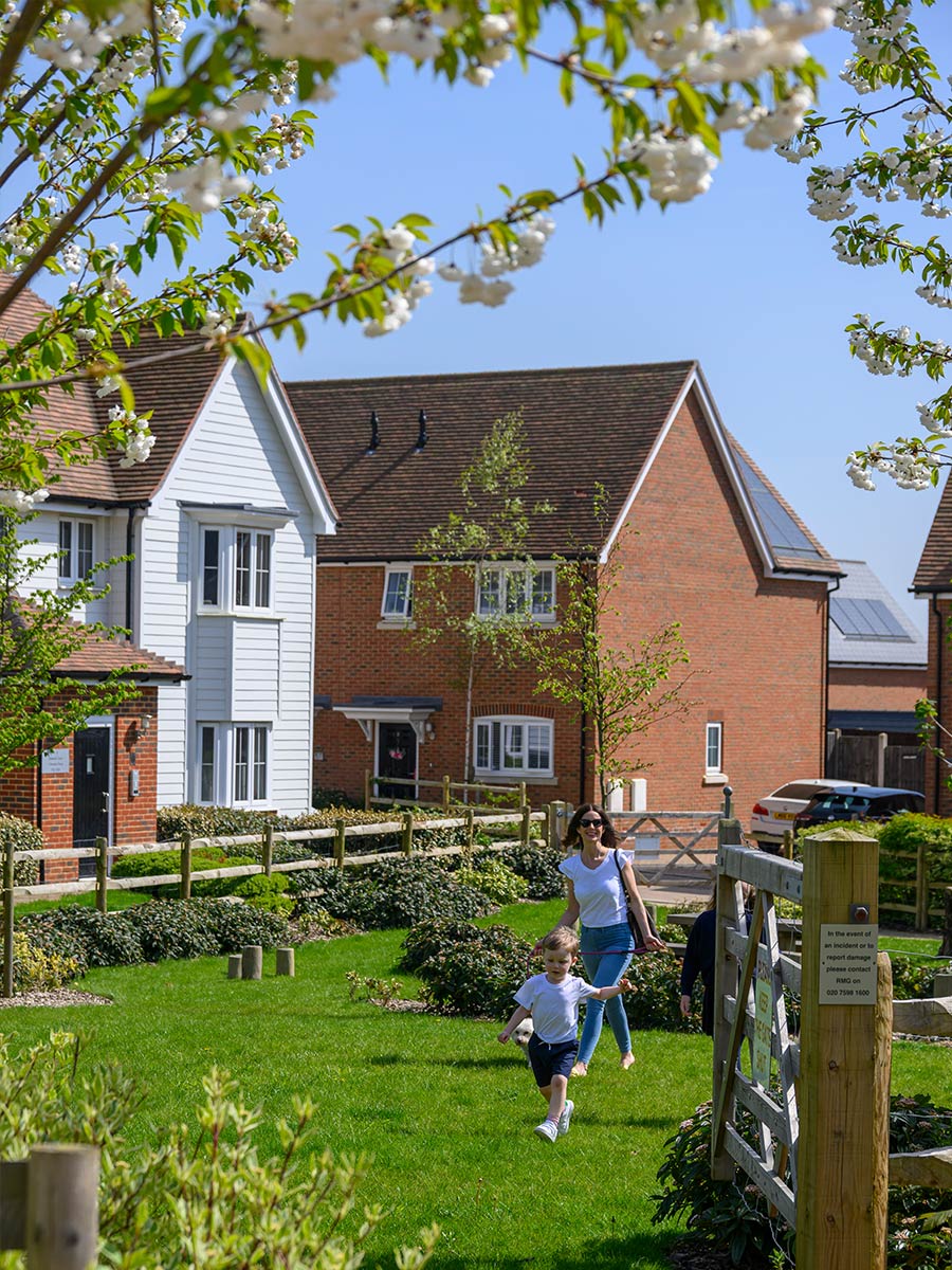 Family on a walk in Hollyfields garden
