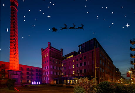An exterior image of Horlicks Quarter with a shadow of Santa's sleigh flying over head