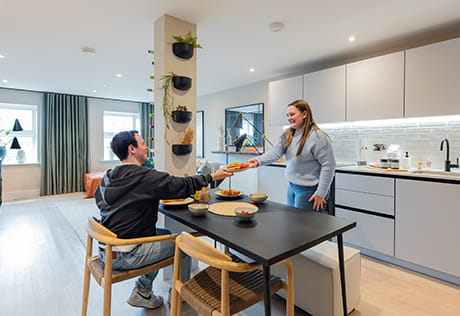 Couple enjoying breakfast in their Horlicks Quarter home