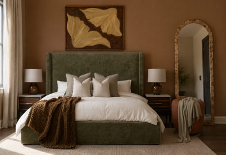 Double bed, wall hanging above, bedside tables, decorated in light brown colour palette.
