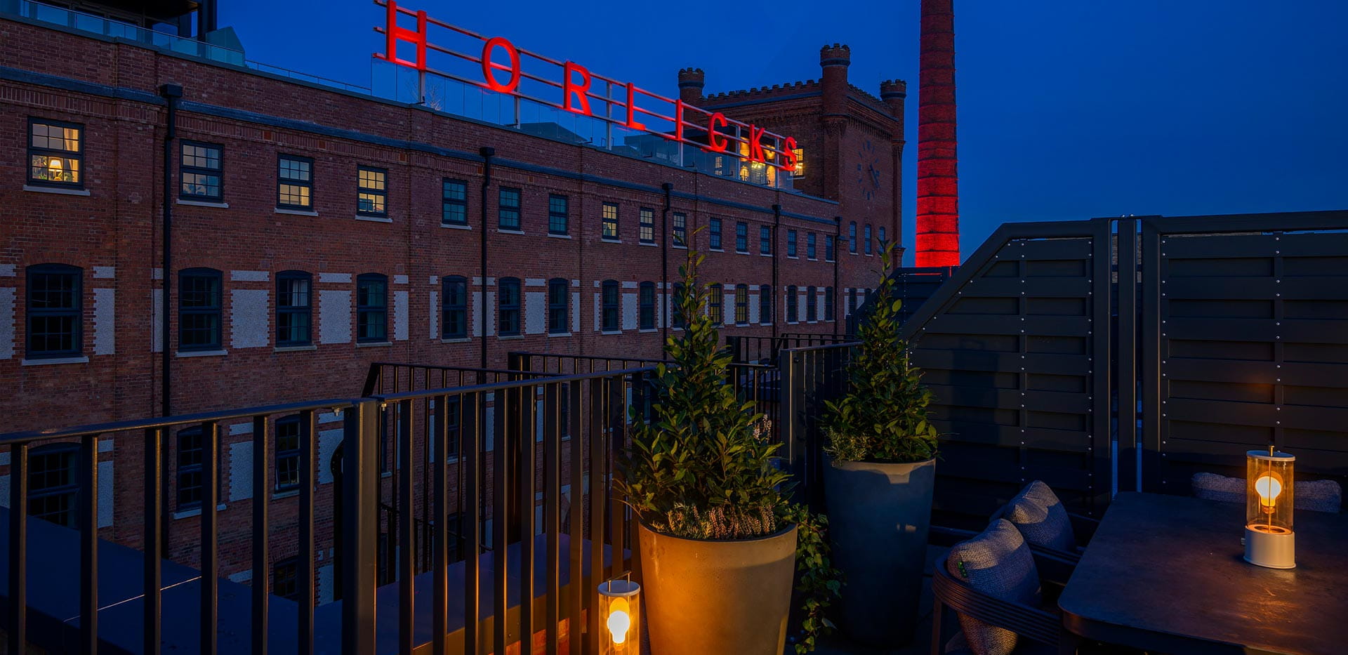 An exterior image of Horlicks Quarters from a terrace view at night