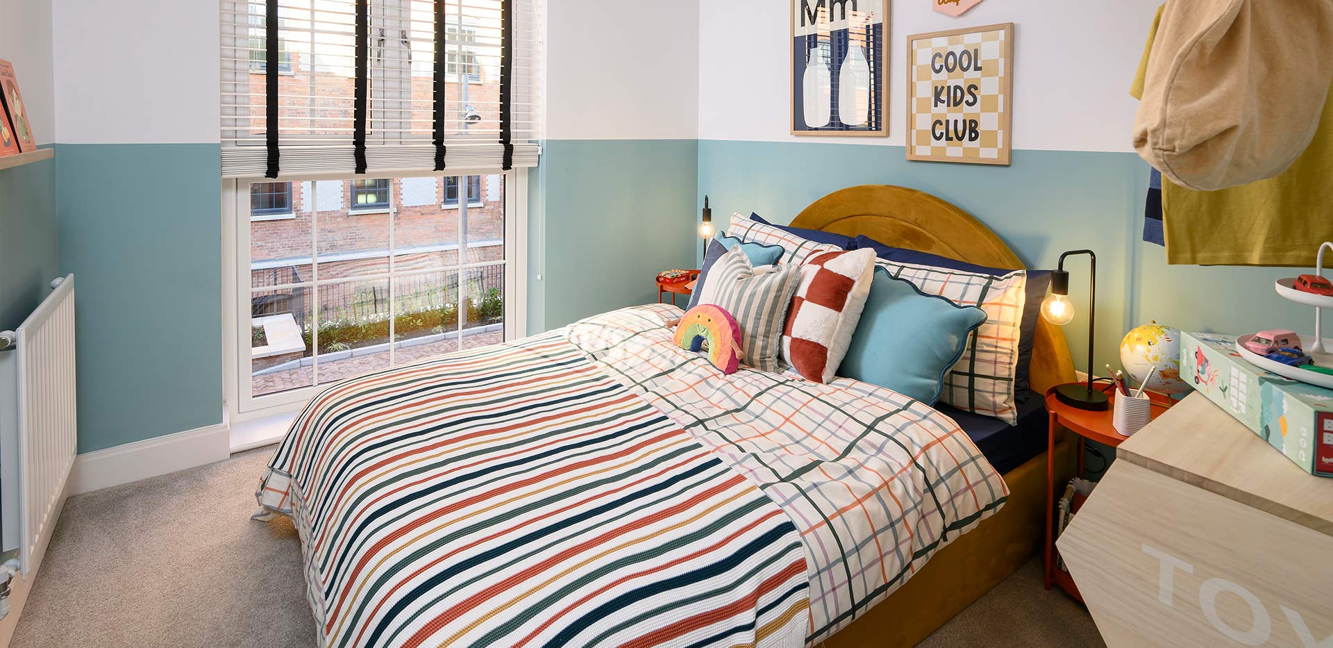 An interior Bedroom with blue walls at the Urban Houses at Horlicks Quarter