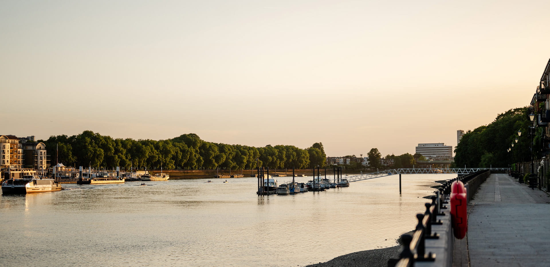 View of the Thames and riverside path , taken at dusk or dawn