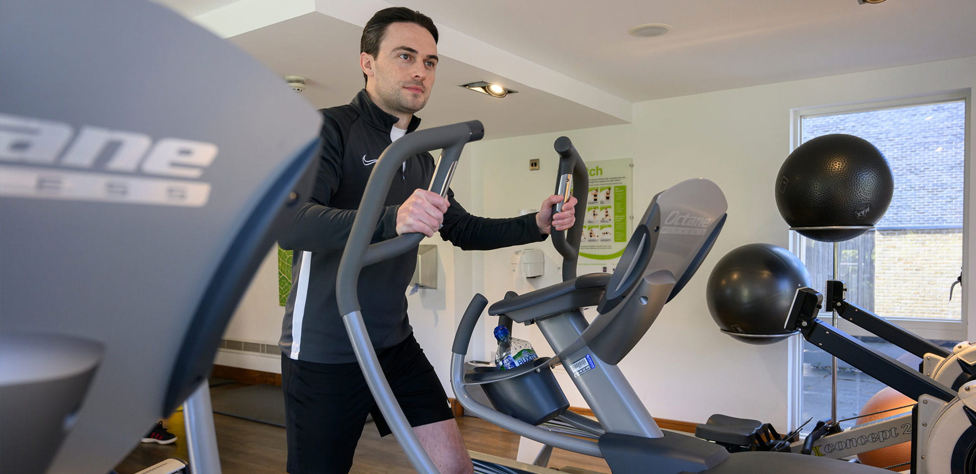 An image of residents at Kidbrooke Village enjoying the residents' facilities, using the Gym.