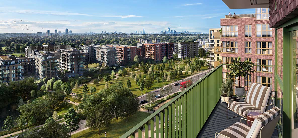 Balcony view overlooking green space and low rise buildings in the background