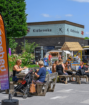An image of people enjoying the sun at kidbrooke village