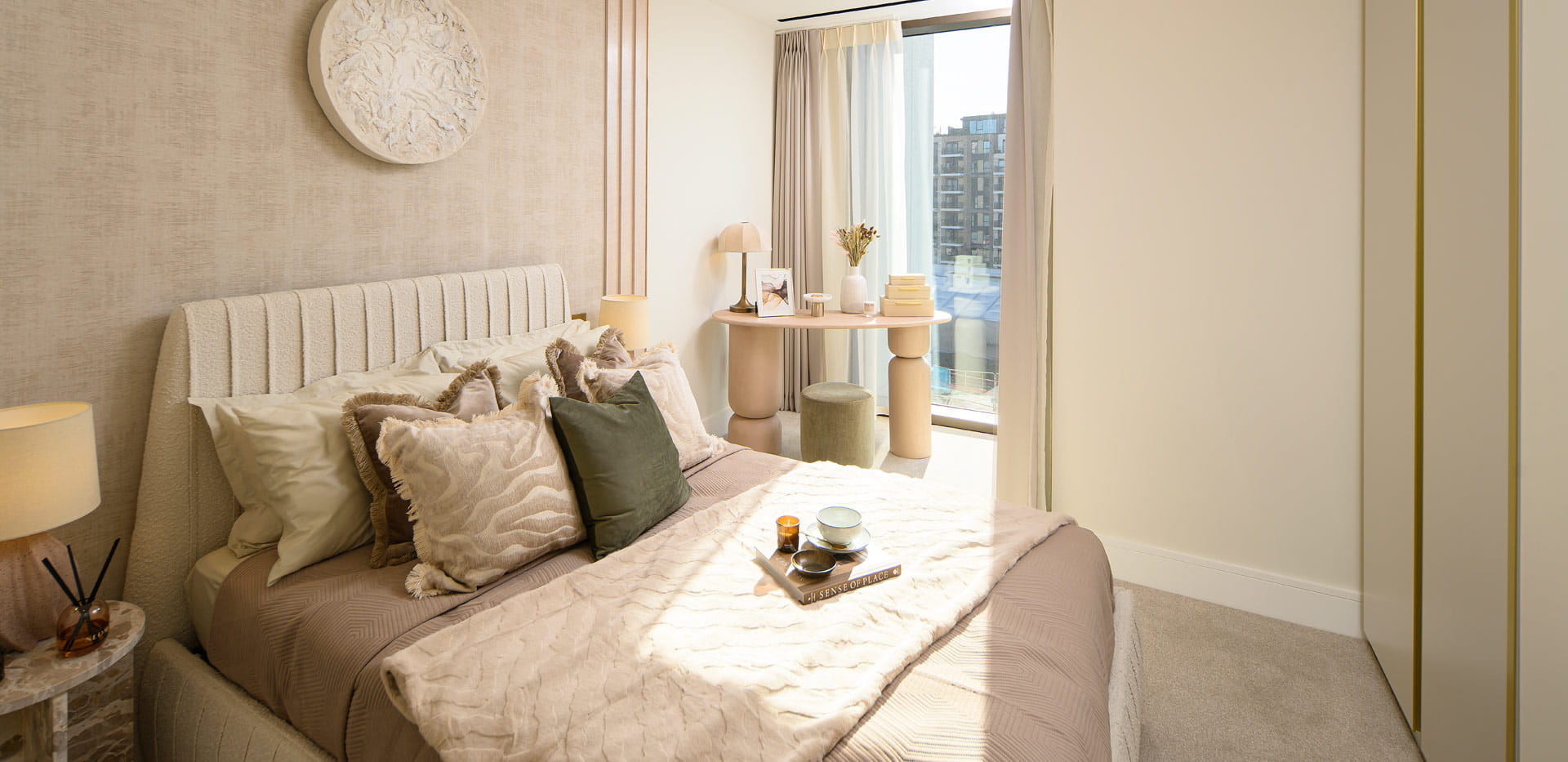 Contemporary design bedroom, bedside tables, natural light streaming onto bed via adjacent tall window