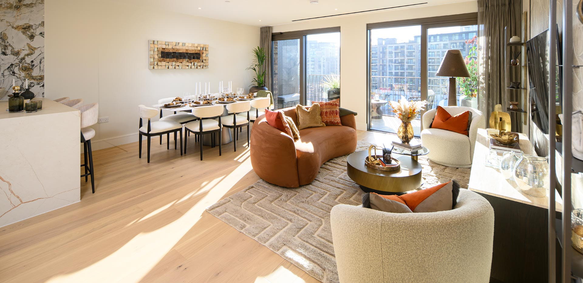 Modern designed living space with sofa and coffee table, floor to ceiling windows