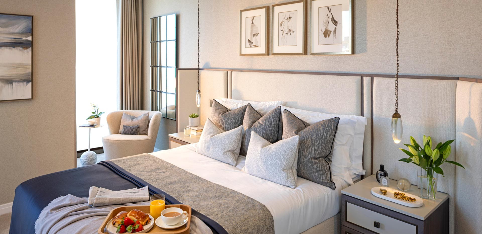 Double bed with contemporary design, bedside tables and wall hangings