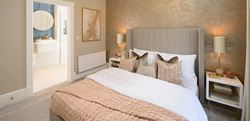 Royal Terrace townhouse bedroom with a central double bed and en suite bathroom