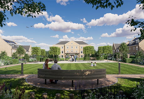 A large residential property in the background with a couple sitting on a park bench facing it, in the foreground