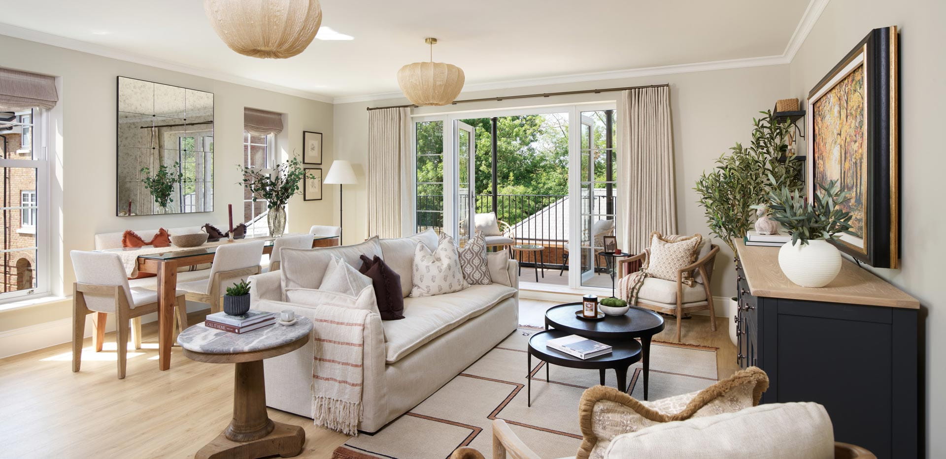 Contemporary style living space in foreground, dining table and balcony doors in background.
