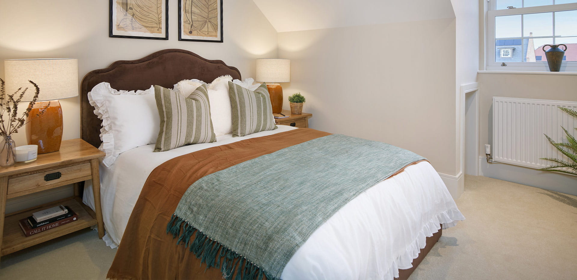 An interior Bedroom with a blue throw over the bed image at the 4 Bedroom Showhome at Leighwood Fields