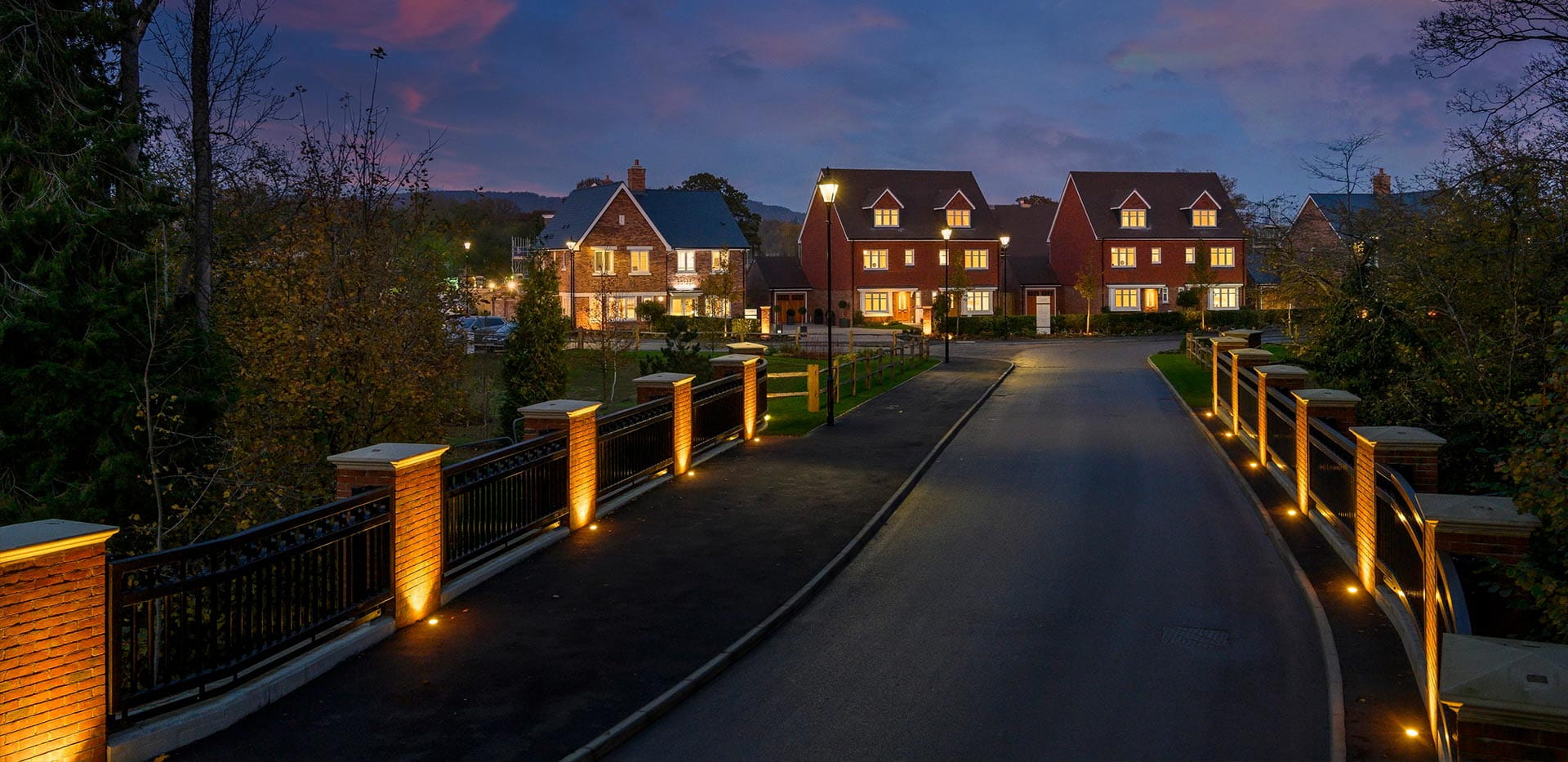An exterior night image of the entrance to Leighwood Fields
