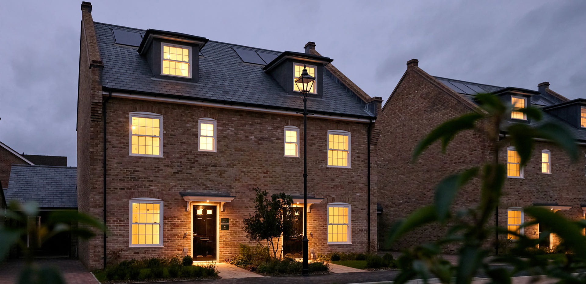 An exterior house image at night at Leighwood Fields