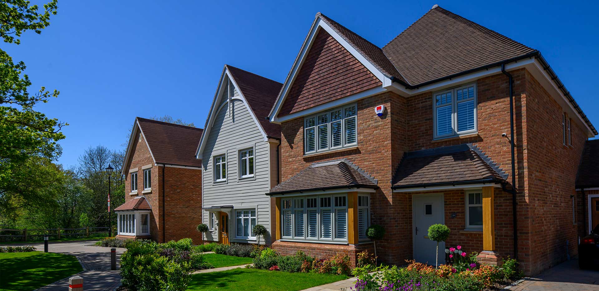 A daytime exterior image of homes at Leighwood Fields