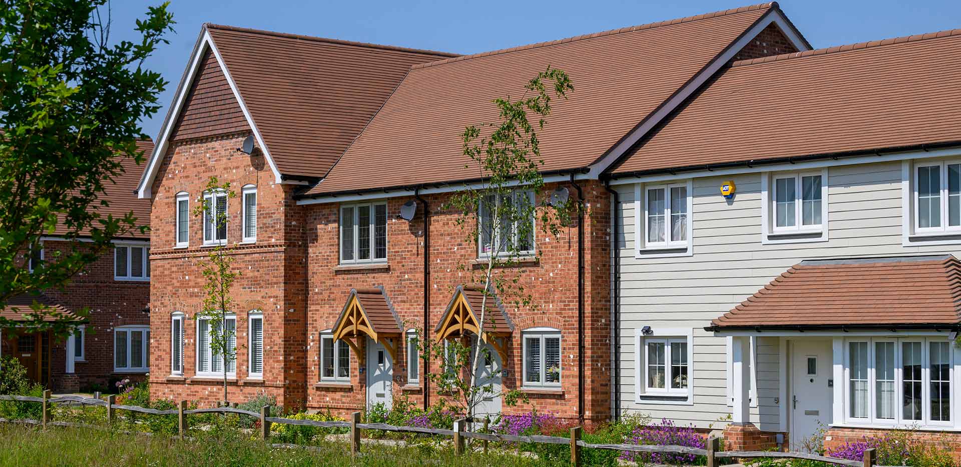 An exterior image of homes near green space at Leighwood Fields