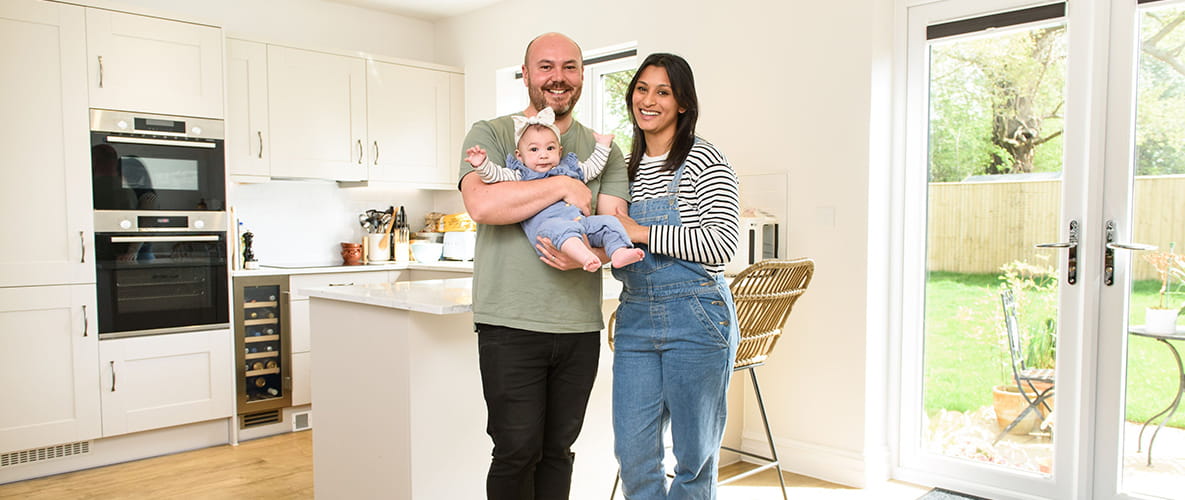 Image of a family posing in their new Berkeley built home