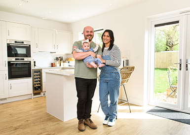 Image of a family posing in their new Berkeley built home