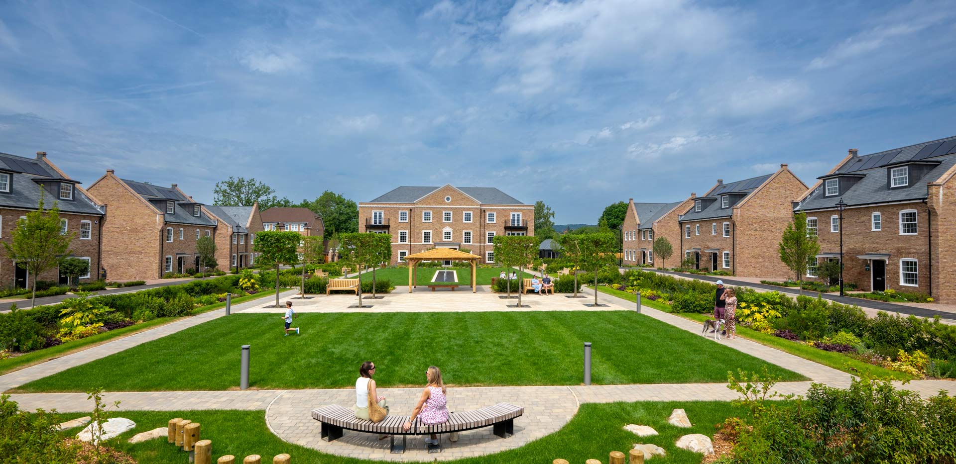 CGI of external development housing facades, central courtyard greenspace.