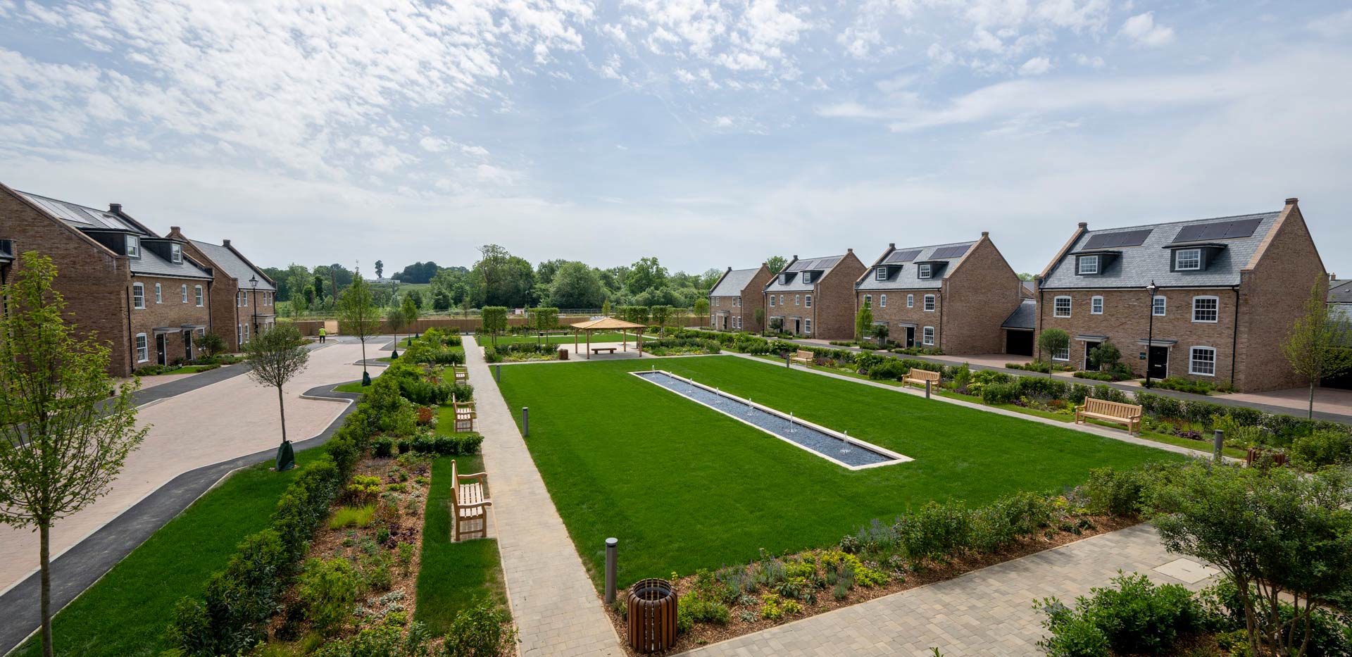 CGI of external development housing facades, central courtyard greenspace.