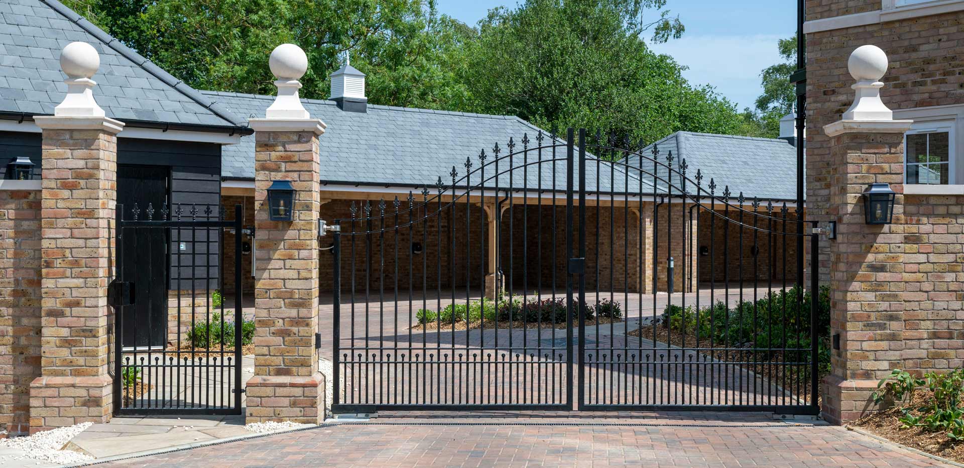 CGI of external development housing private drive-in gate.
