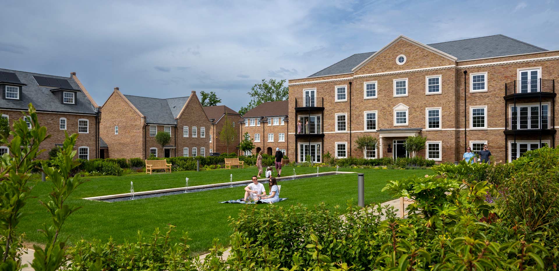 CGI of external development housing facades, central courtyard greenspace.