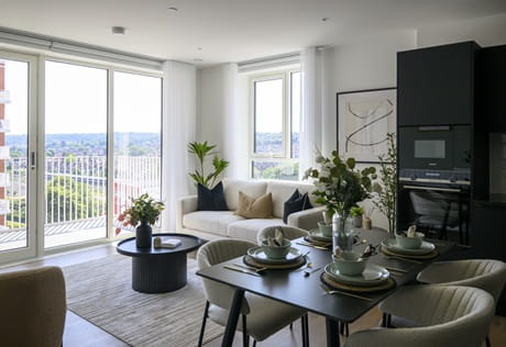 Modern designed living and dining space, ample natural lighting from tall windows and balcony doors.