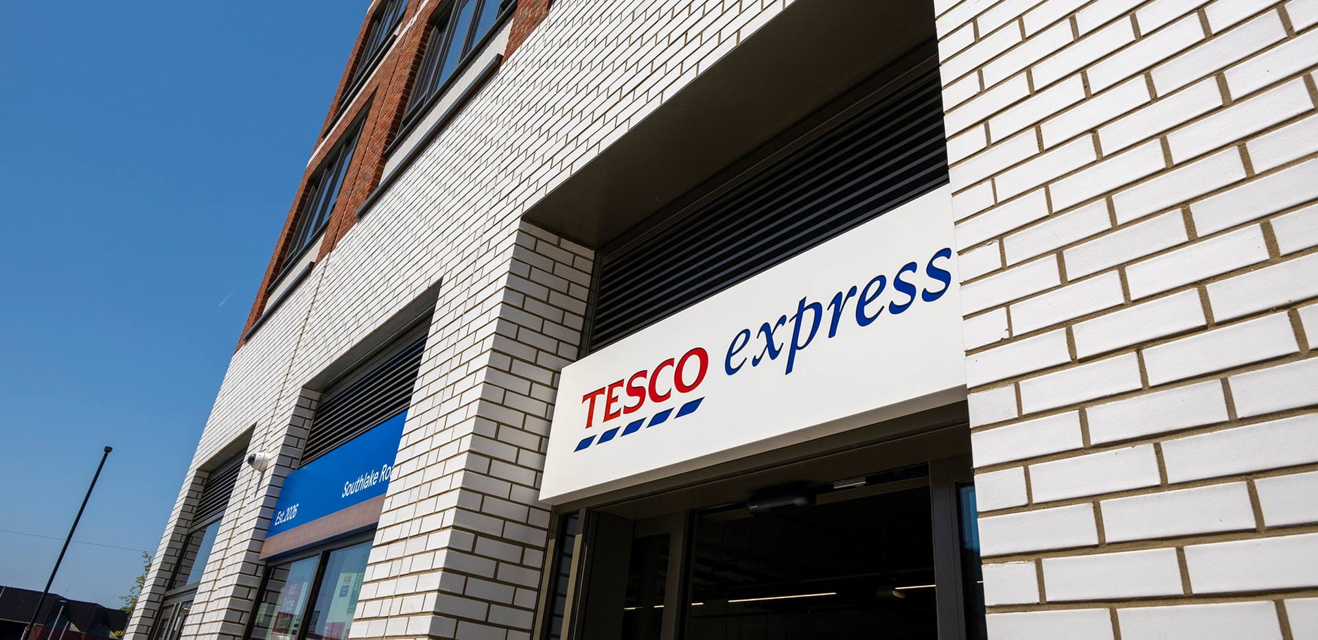 An exterior photograph of the Tesco Express at Lombard Square