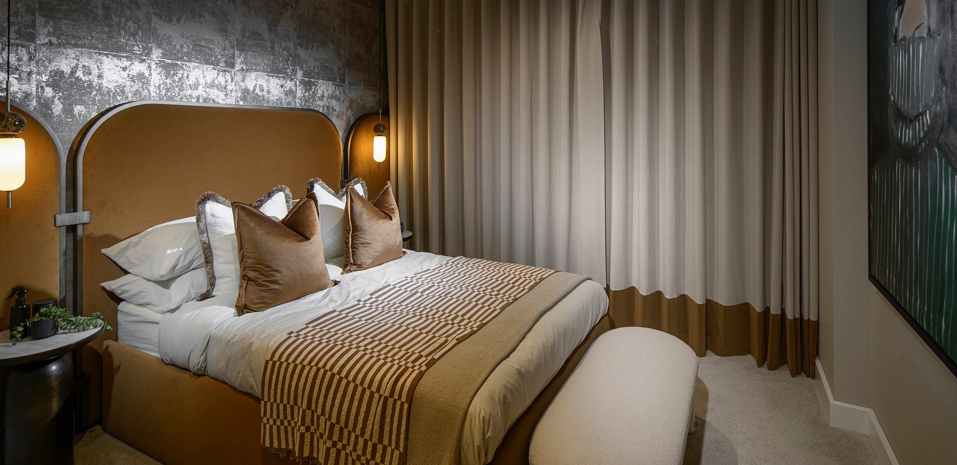 An interior Bedroom image with a dark feature wall at Fero House
