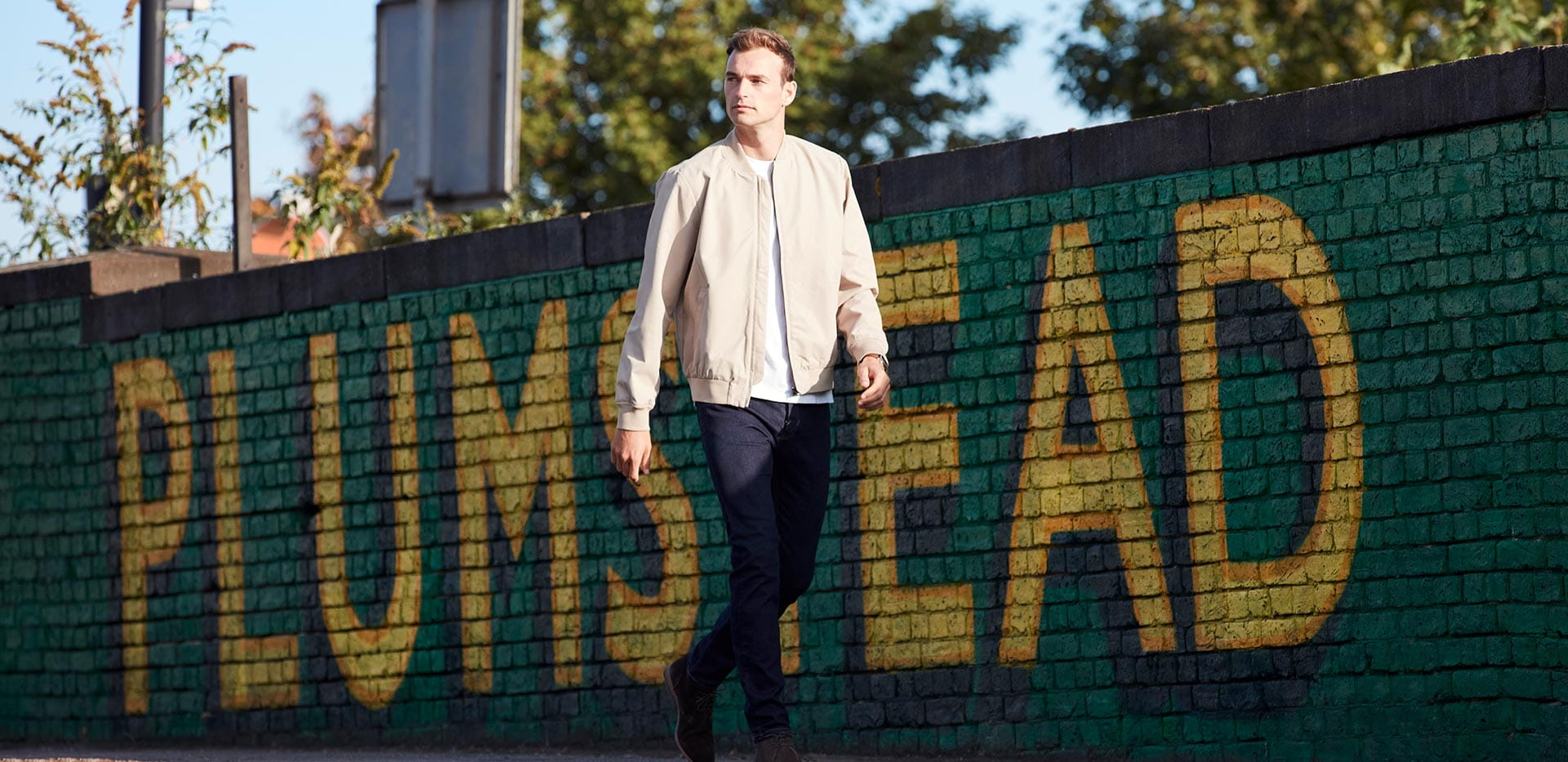 Photography of a person walking outside a train station