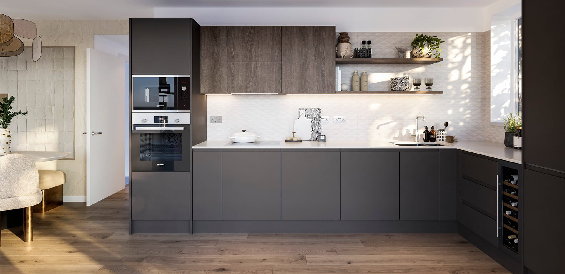 An interior image of a kitchen with dark cupboards at Rosa House