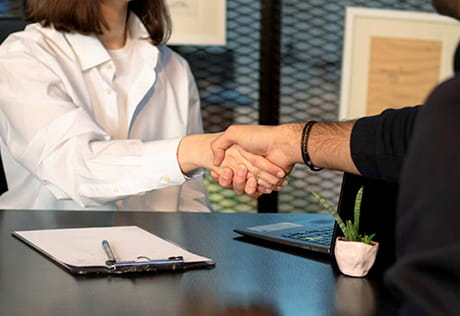 An image of people shaking hands