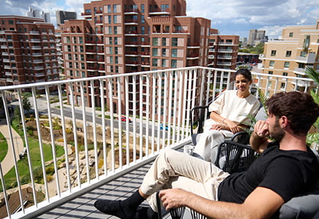 An image of a couple sat on a balcony at Lombard Square