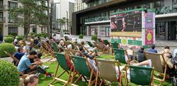 Photograph of local residents enjoying outdoor cinema events at London Dock